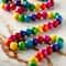 12 Packs: 76 ct. (912 total) Multicolored Wood Rondelle Beads, 10mm by Bead Landing™